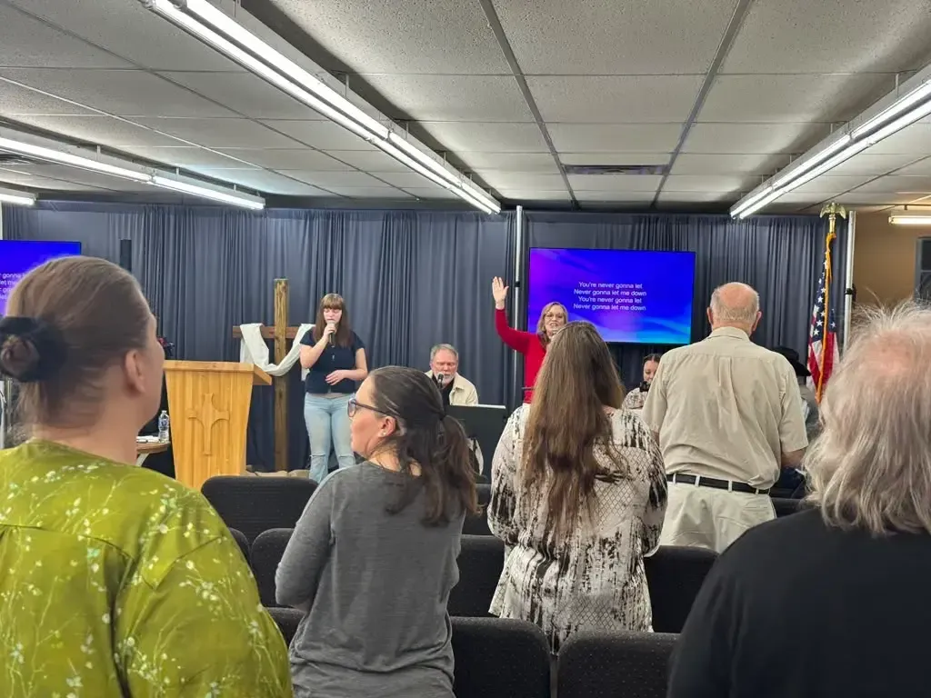 Church family standing in worship during a Sunday service